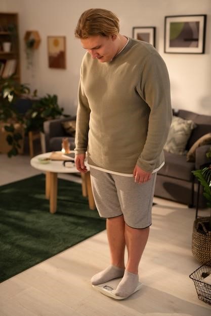 Man standing on a scale at home, checking his weight.
